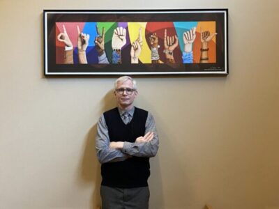 DIVERSITY by Anthony David Gipe Hon. Anthony David Gipe stands in front of his painting, DIVERSITY